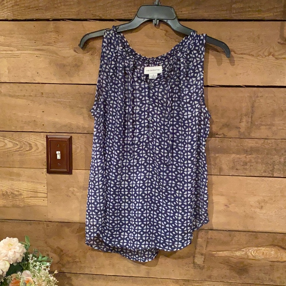 Medium blue and white flowing sleeveless blouse